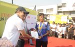 Mr. Anand  felicitating the winner of _Femina Marathon-Run to Save The Girl Child_